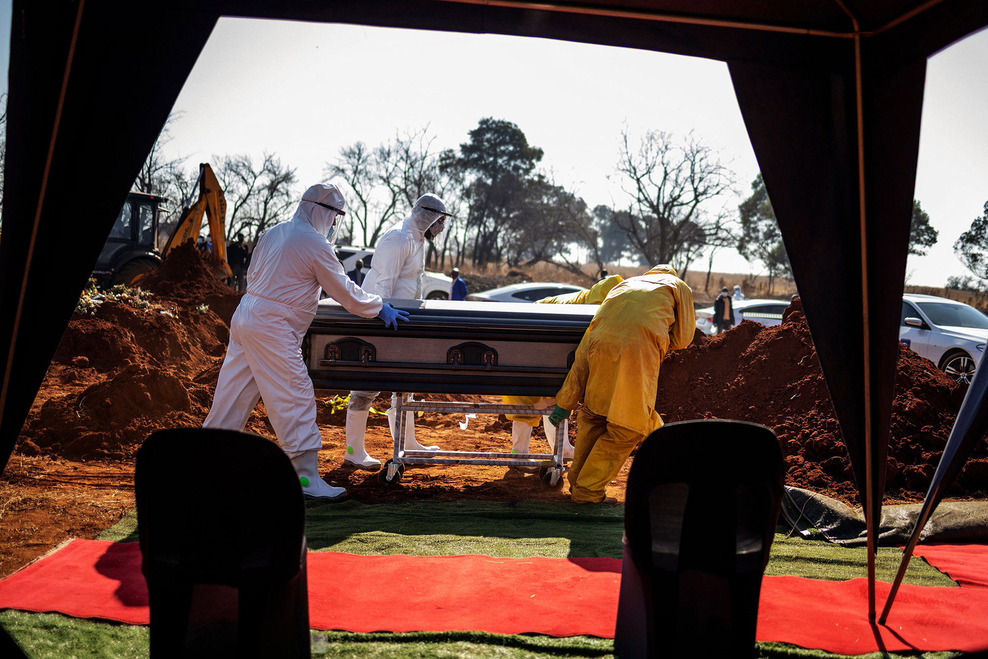 Undertakers push a casket in Soweto, on July 21.