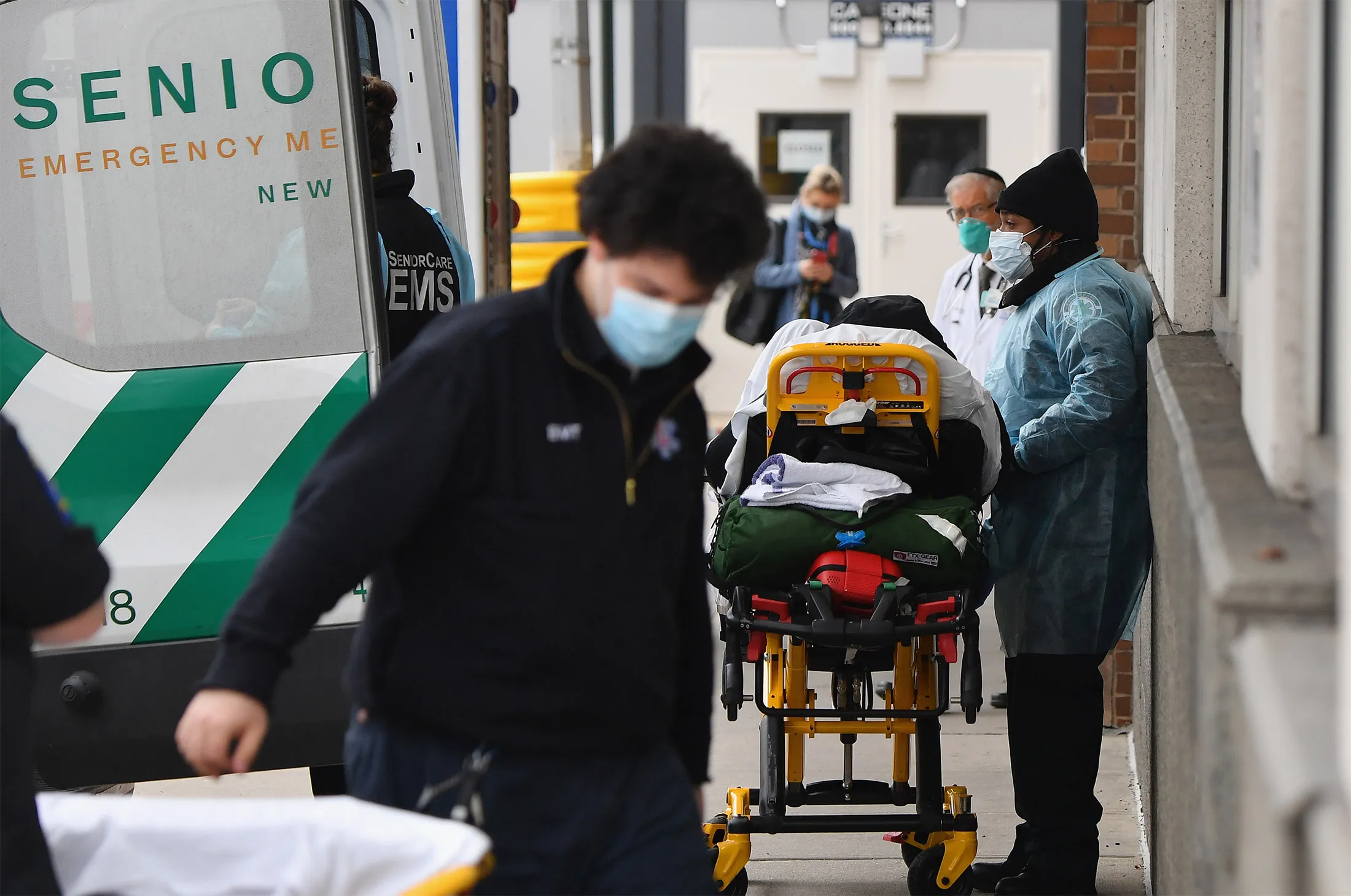 Healthcare workers transport a patient from an ambulance to a hospital in Brooklyn,&nbsp;New York, on Jan. 4.