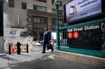 A pedestrian walks along Wall Street near the New York Stock Exchange (NYSE) in New York, U.S.