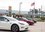 Tesla vehicles next to charging stations at a Sheetz gas station in Breezewood, Pennsylvania.