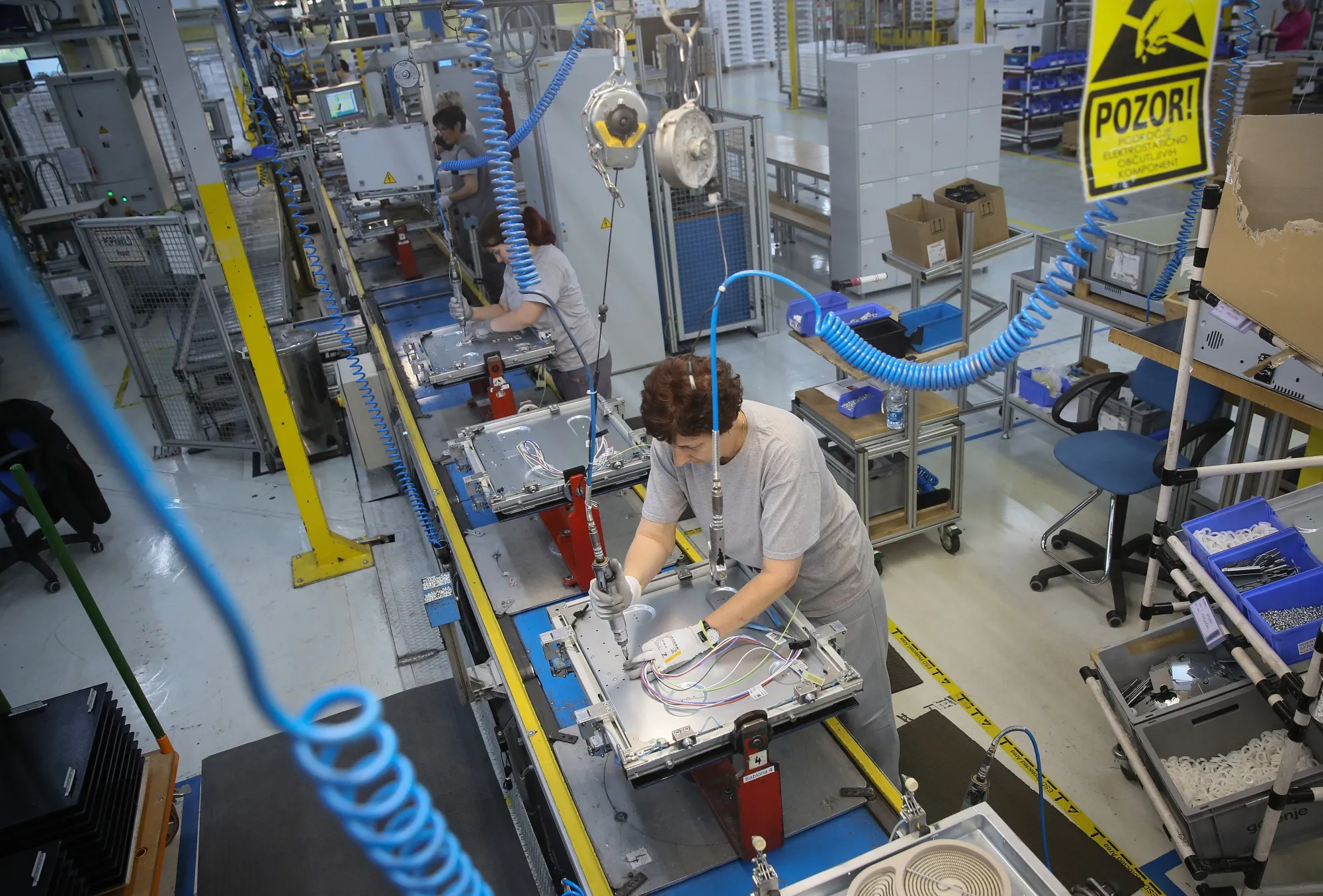 An employee assembles an electric induction cooker unit in Velenje, Slovenia.&nbsp;