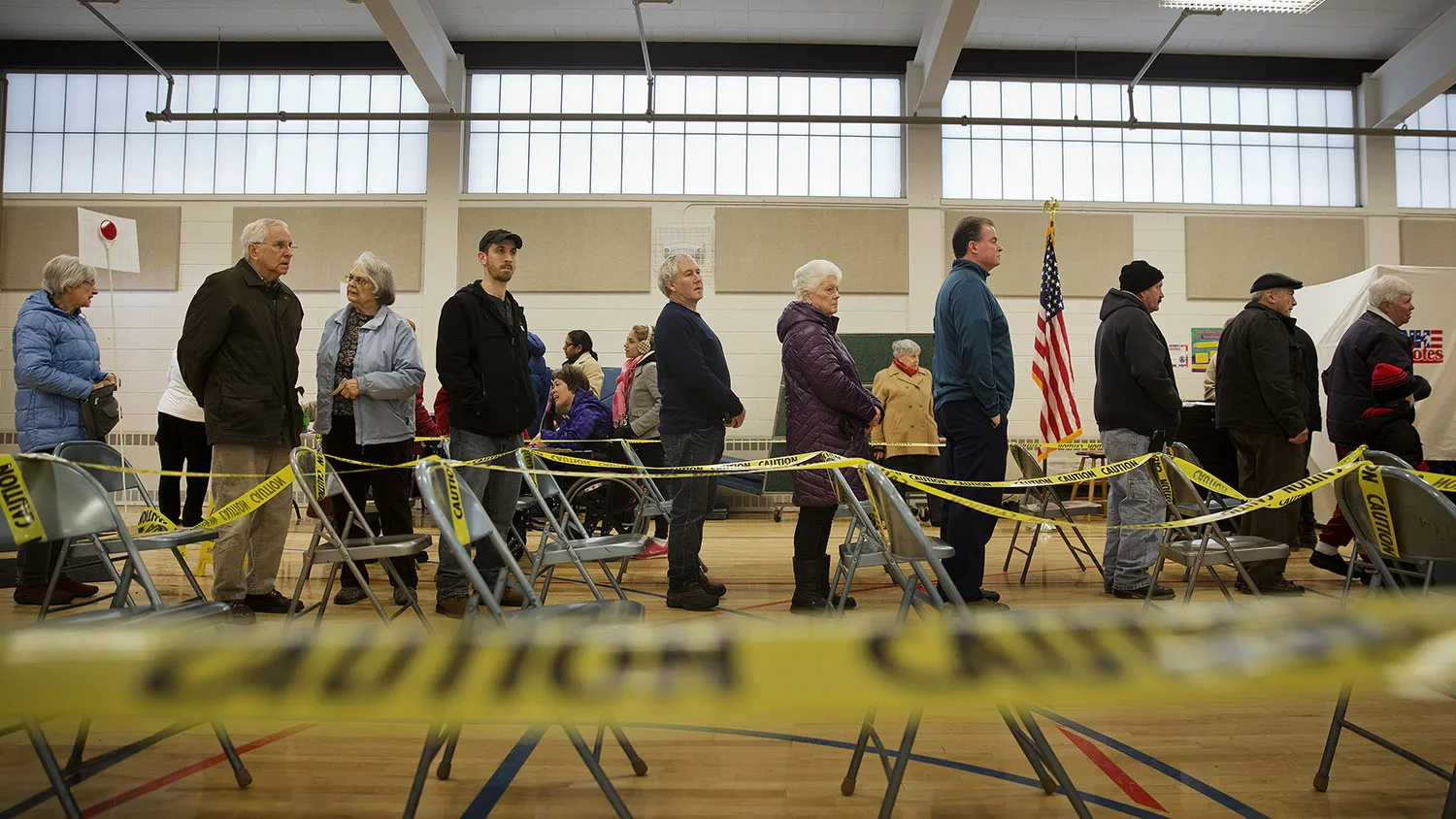 Voters wait in line to cast ballots at a polling station inside Broken Gound Elementary School in Concord, New Hampshire, on Feb. 9, 2016.
