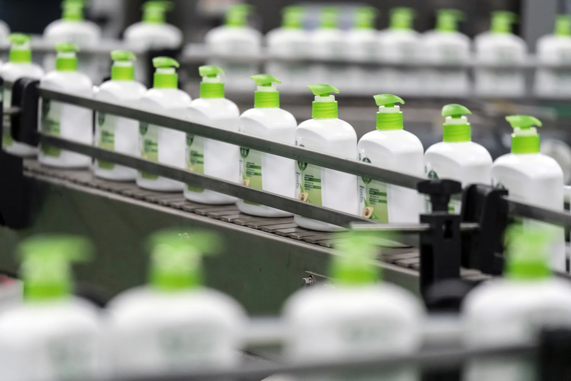 Bottles of Dettol liquid handwash move along a conveyor on a production line at a Reckitt Benckiser Plc production facility.