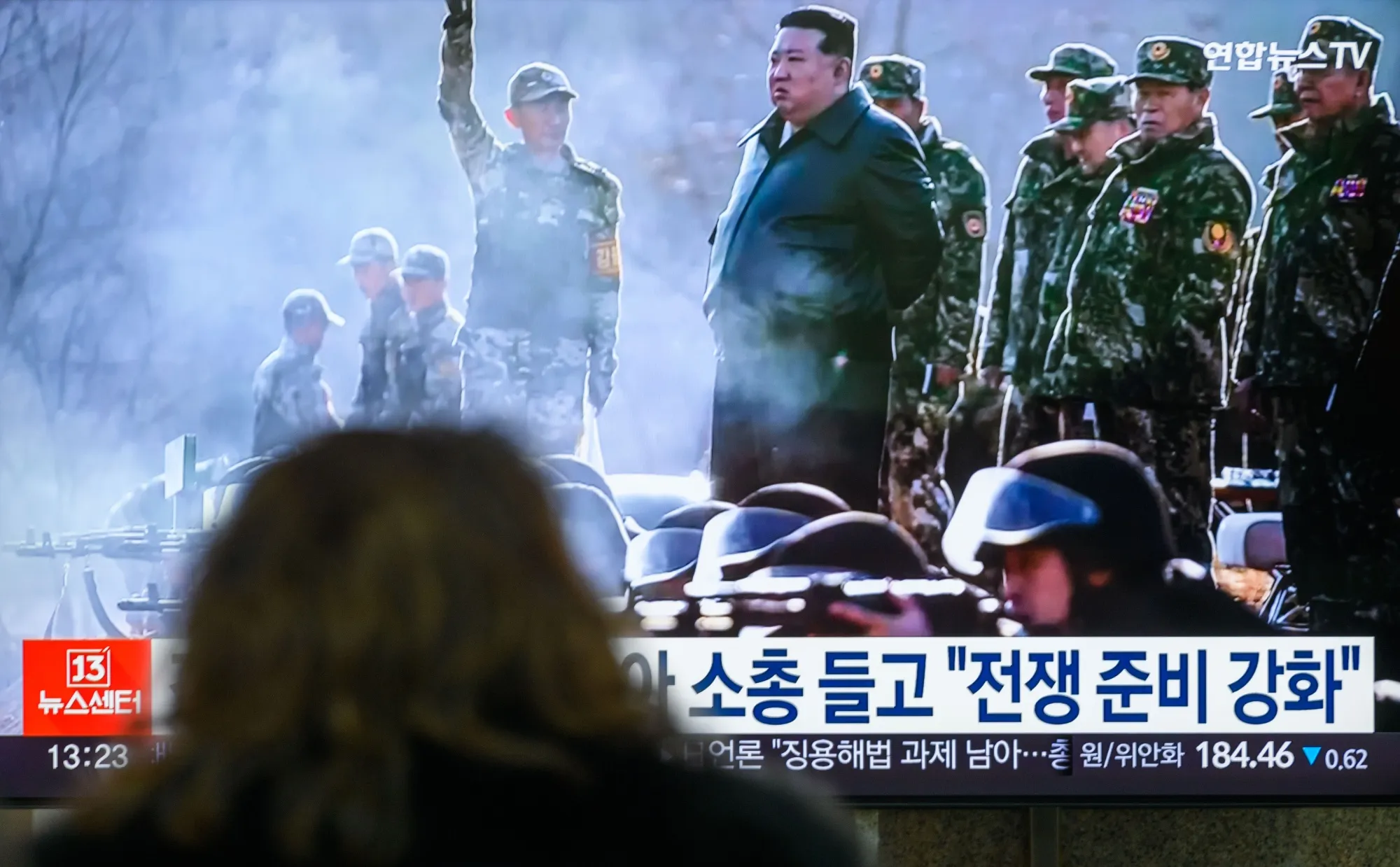 Kim Jong Un, center, visiting a military training base, displayed on a television at Seoul’s Yongsan Railway Station.