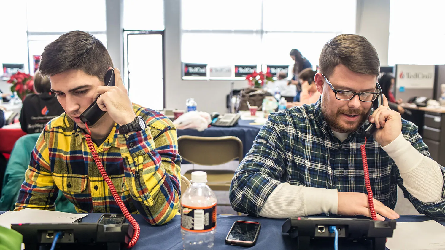 Brian Sikma (left) and Jeremy Carpenter, volunteers from Milwaukee, Wisconsin, phone-bank at the campaign headquarters of Ted Cruz on Jan. 22, 2016, in Urbandale, Iowa.
