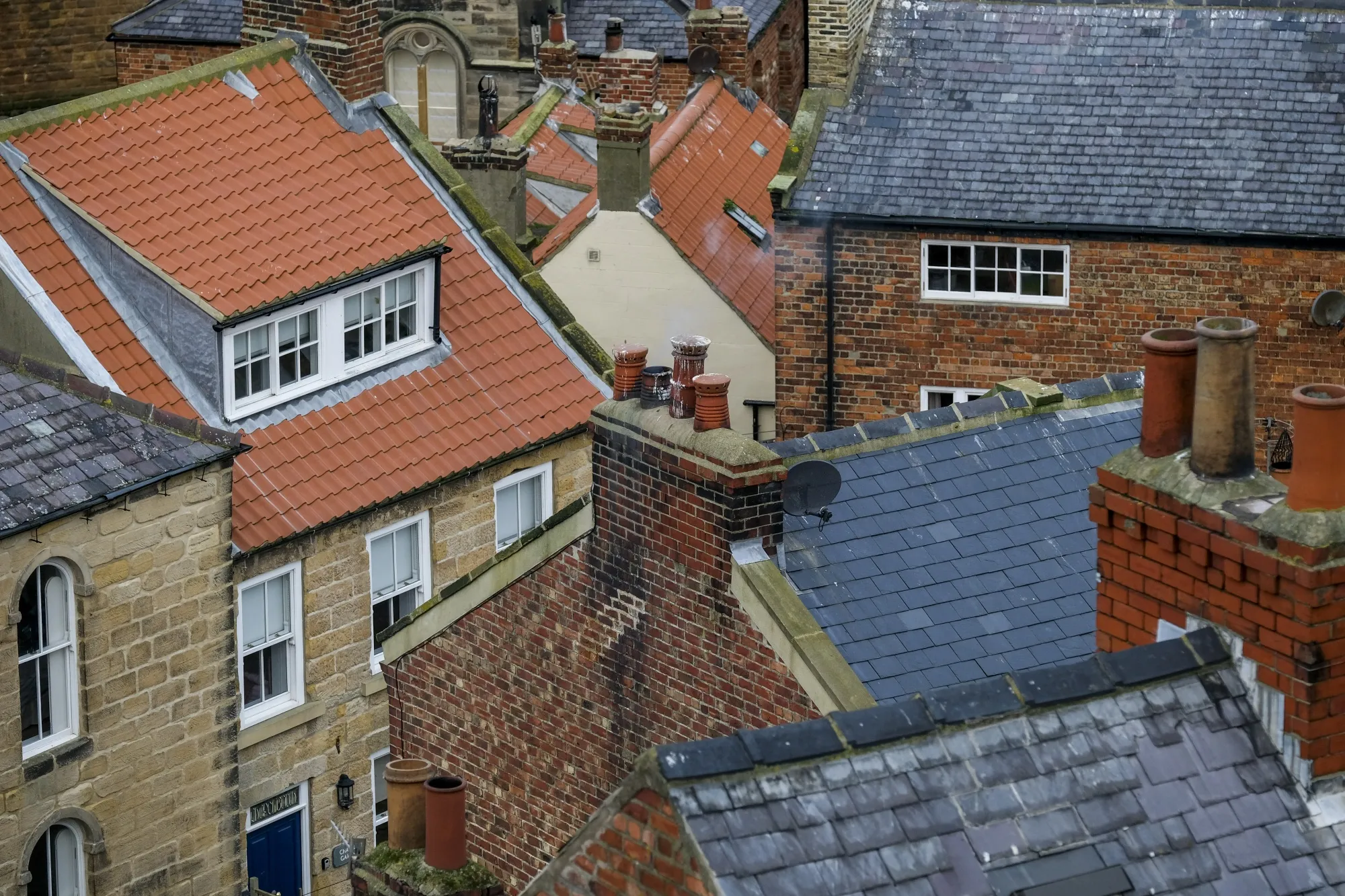 Rooftops of residential houses stand in Staithes.