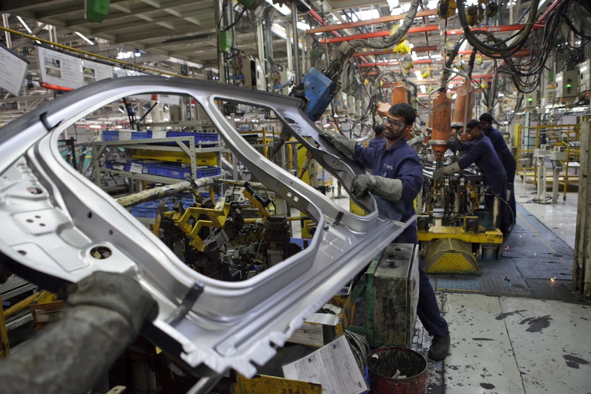 Ford Motor Co. employees assemble vehicle body parts at the&nbsp;Maraimalai Nagar factory in Chengalpattu, India in 2012.&nbsp;