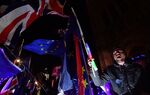 Anti-Brexit campaigners protest outside the Houses of Parliament in London on March 12, 2019.