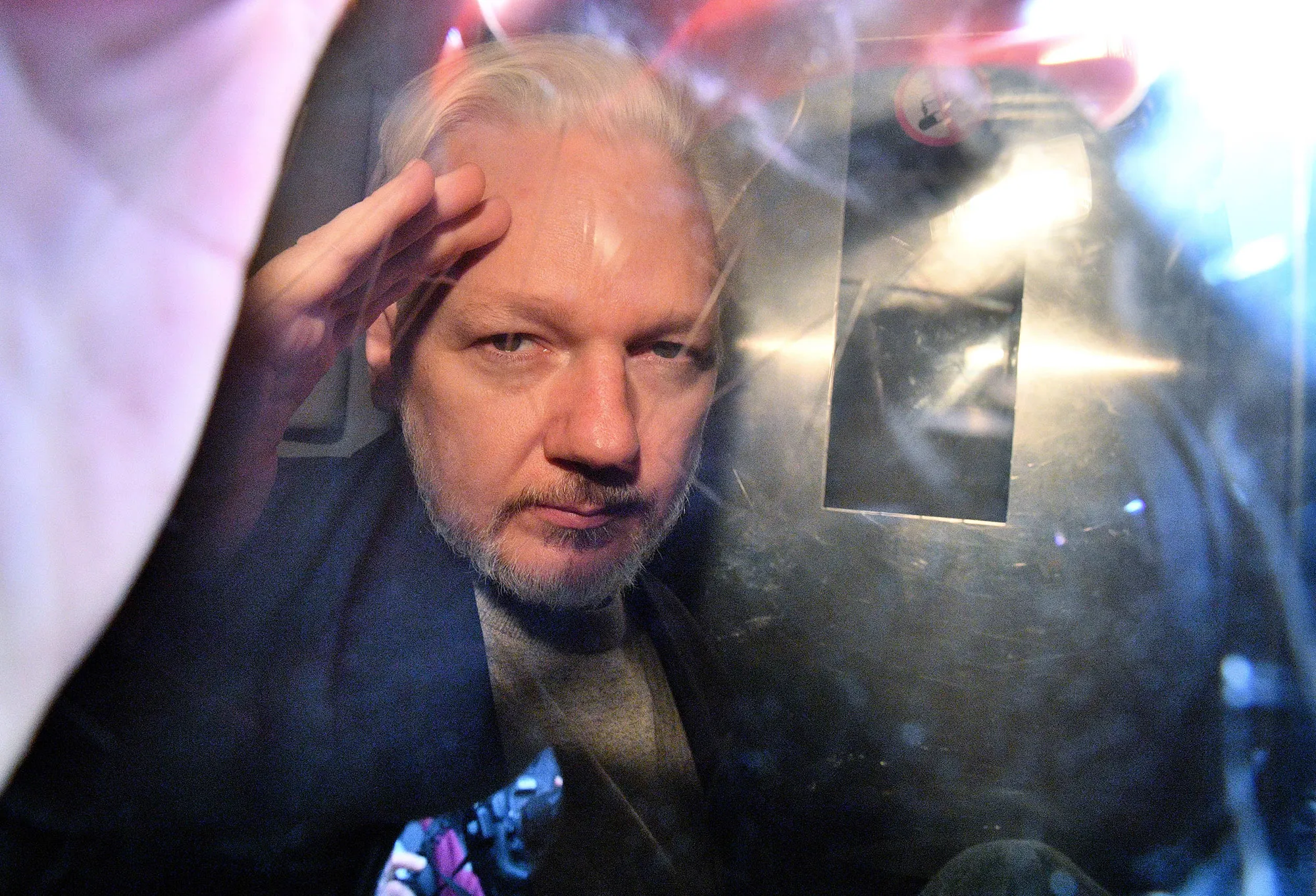 Julian Assange leaves court in a security van in London on May 1, 2019.