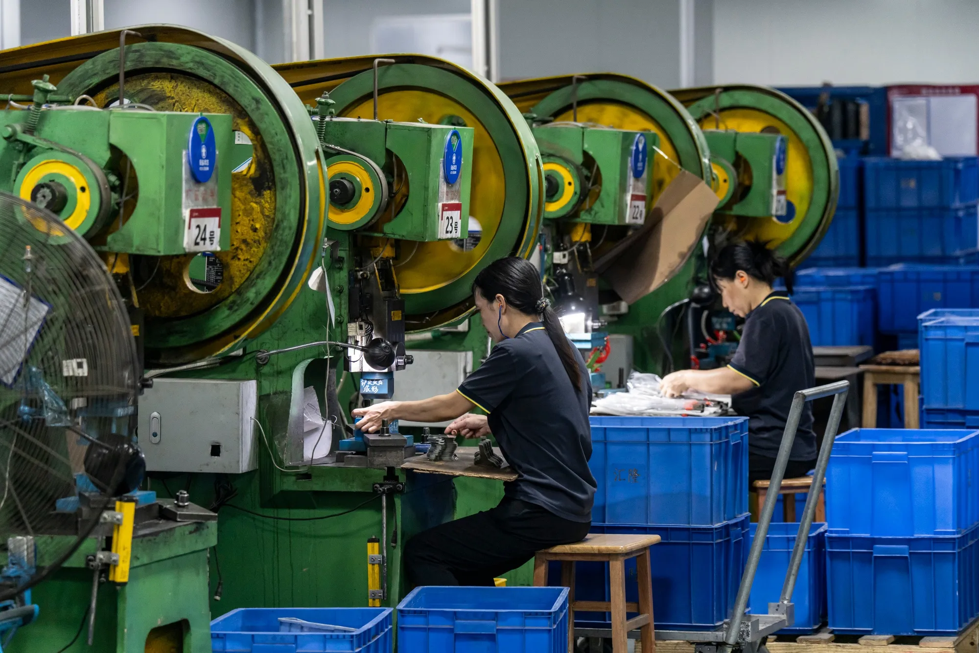 Workers on the production line at a&nbsp;kitchen utensils&nbsp;factory near Zhuhai, China.