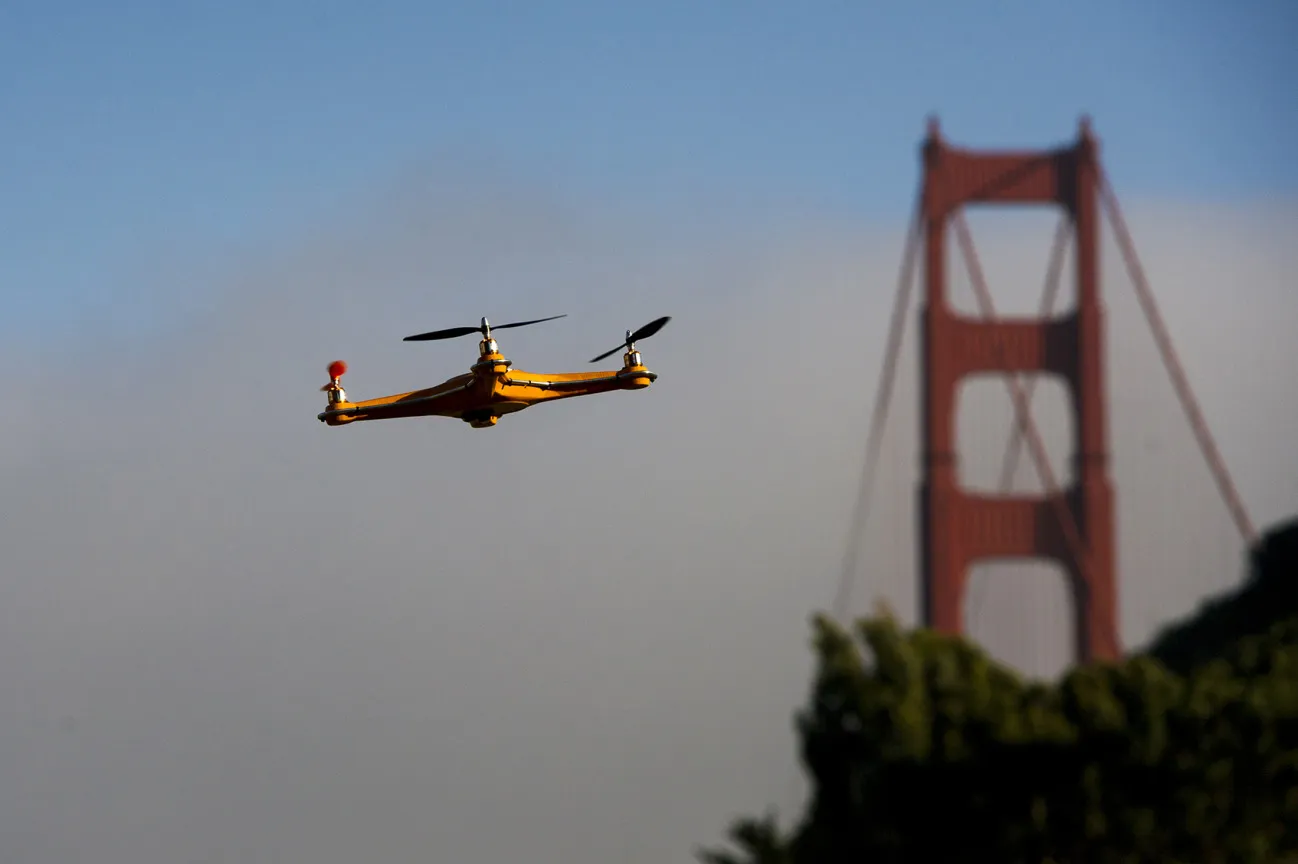 A drone flies in front of the Golden Gate Bridge.
