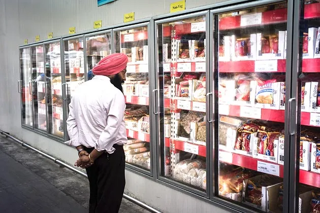 A shopper browses frozen foods at a Bharti Walmart Pvt. Ltd. Best Price Modern Wholesale store near Chandigarh, India