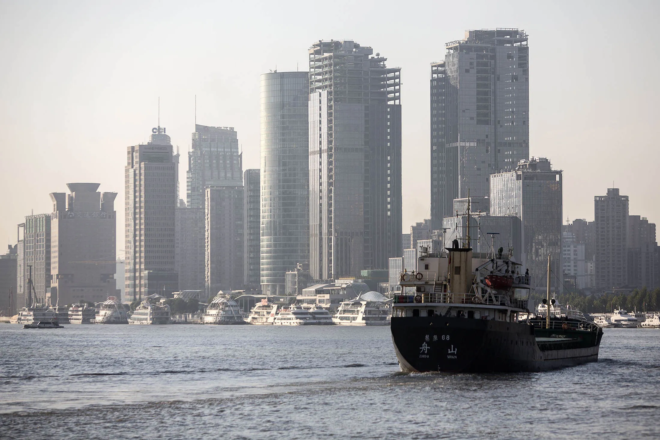 A ship sails down the Huangpu River in Shanghai.

