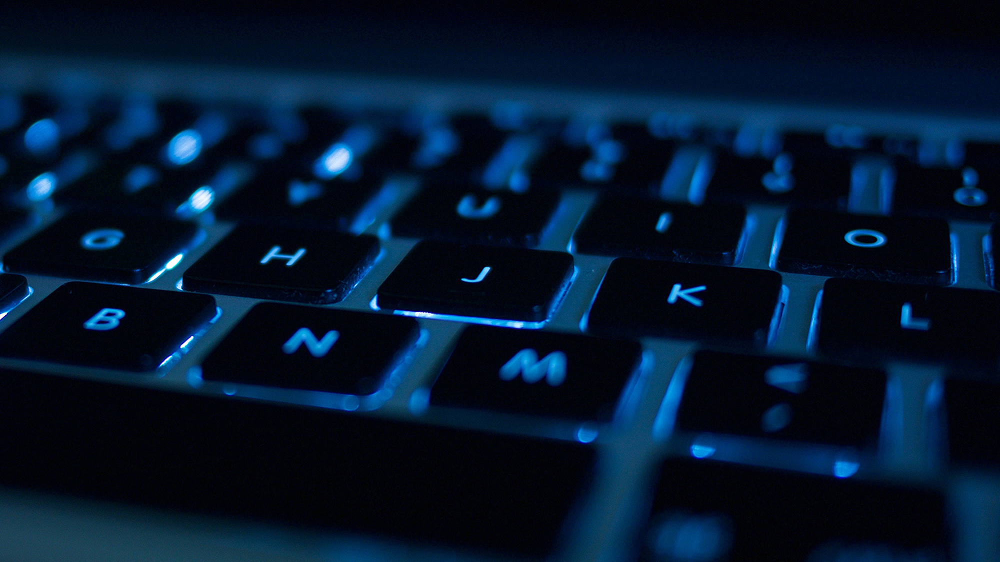 Computer keyboard green illuminated with euro symbol. News Photo - Getty  Images