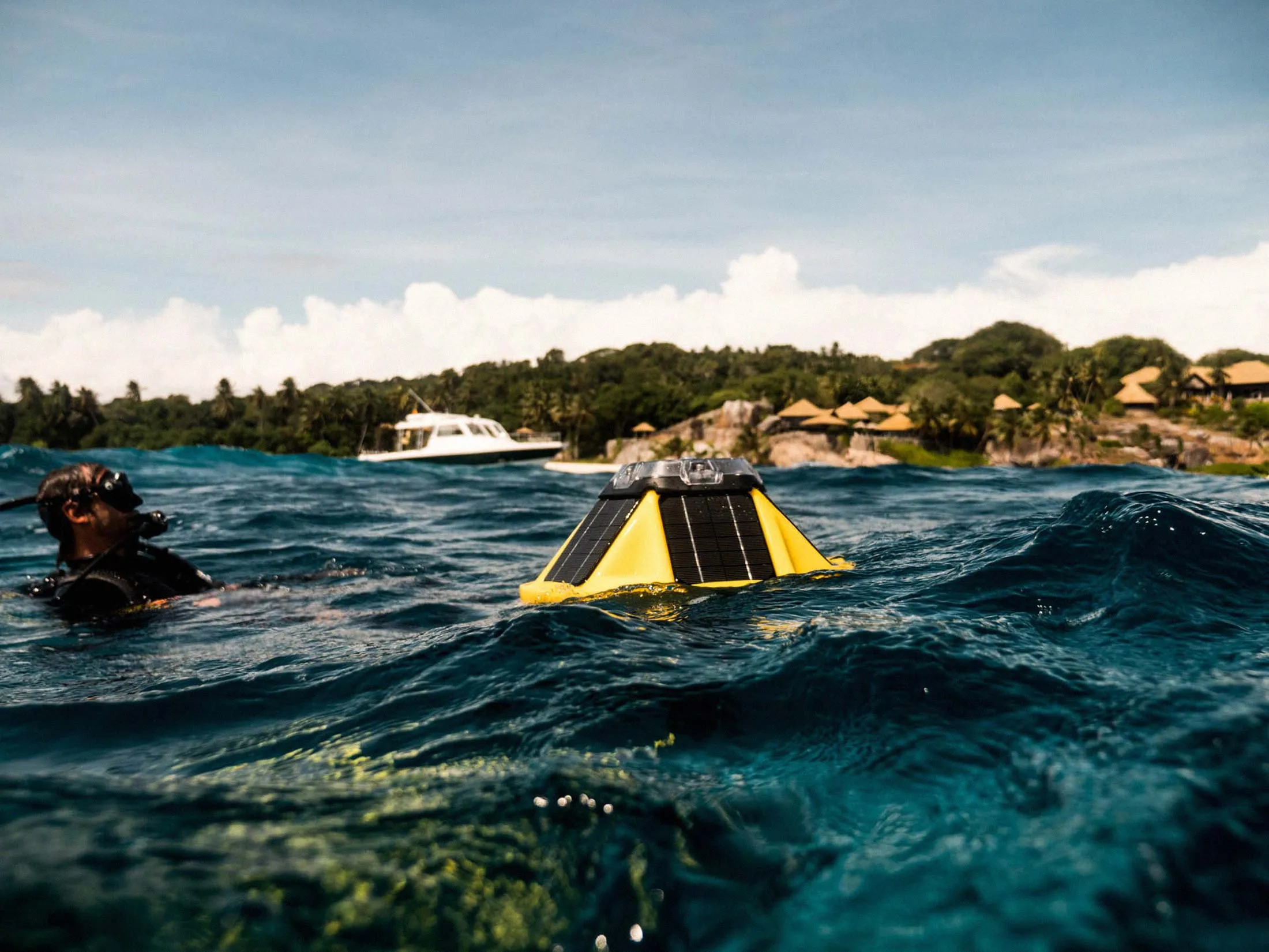 A diver oversees the deployment of a Sofar Spotter.&nbsp;