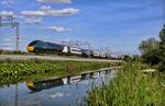 A British Rail Class 390 Pendolino drives through Anstey, U.K. 