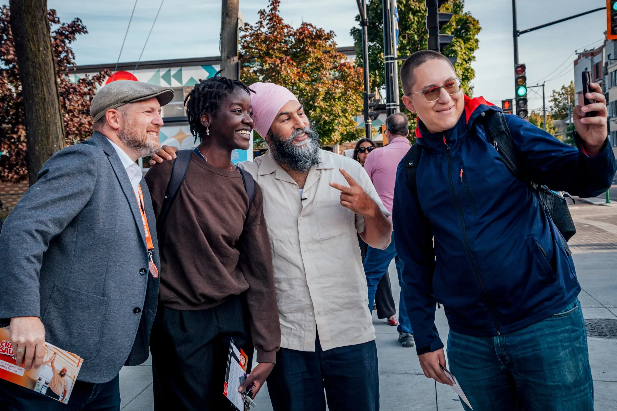 Craig Sauve, New Democratic Party candidate for the LaSalle-Emard-Verdun riding, left, and Jagmeet Singh, leader of the NDP, second right, meet with voters.