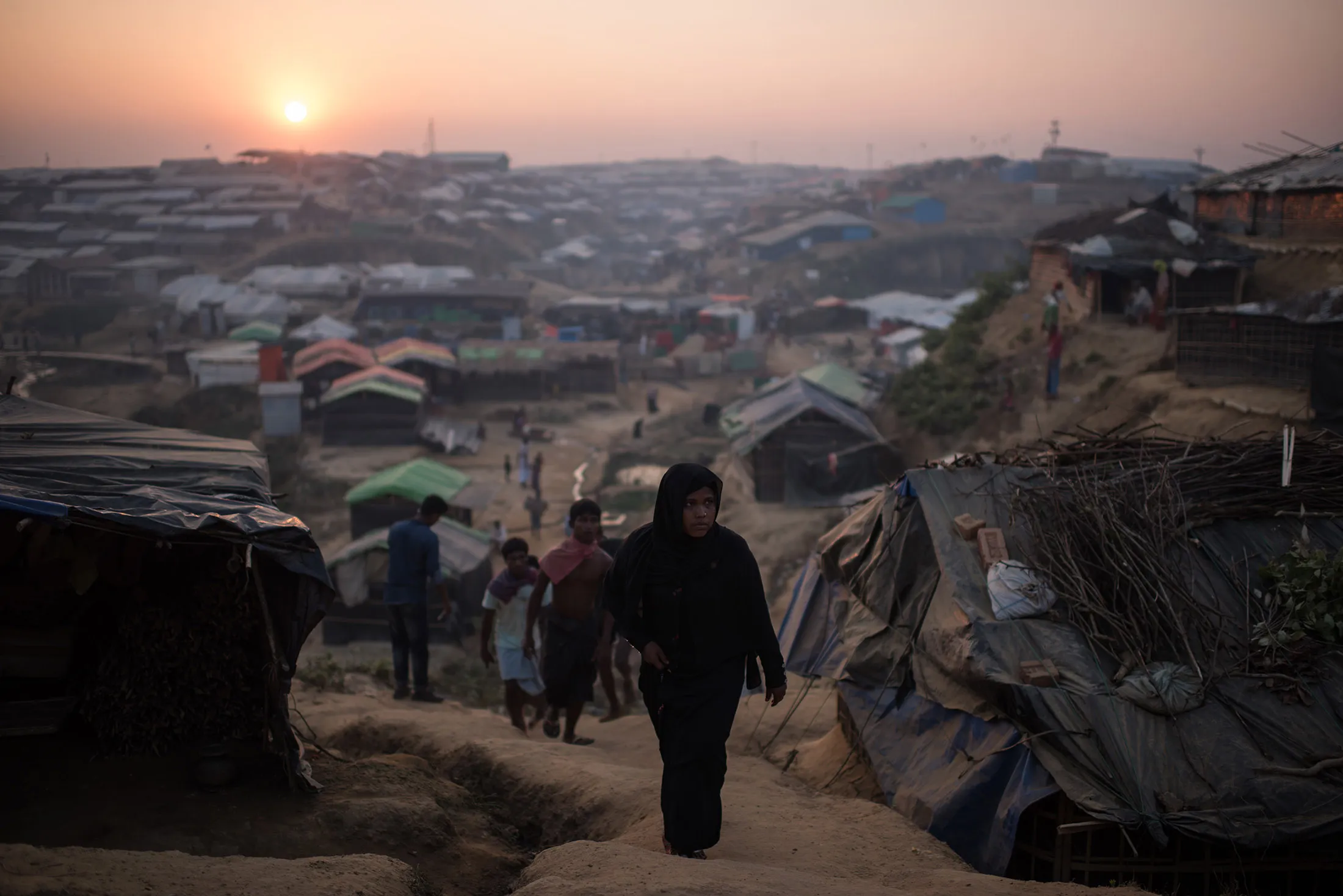 Rohingya&nbsp;refugees walk through the Kutupalong refugee camp in Bangladesh on Nov. 27, 2017.&nbsp;