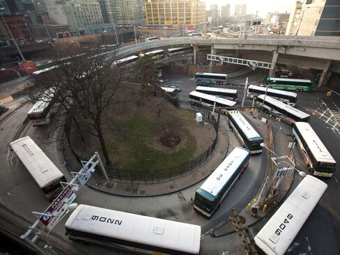 Buses wait in line to enter the Port Authority Bus Terminal in New York on April 2, 2014. Once a vital force in the regional economy, the Port Authority has been sapped by mounting deficits.