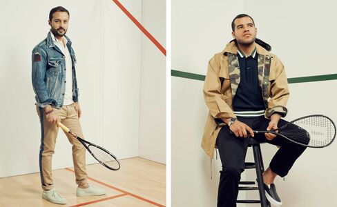 On Vargas: Denim jacket by Saint Laurent, white pique polo by Fred Perry, khaki pants by Valentino, watch by Cartier, leather bracelet by Giles & Brother, sneakers by Common Projects. On Gens: Khaki jacket with camo detail by Dior Homme, cashmere polo by Tomorrowland, pants by Unis, watch by Dior, slip-on sneakers by Vince.