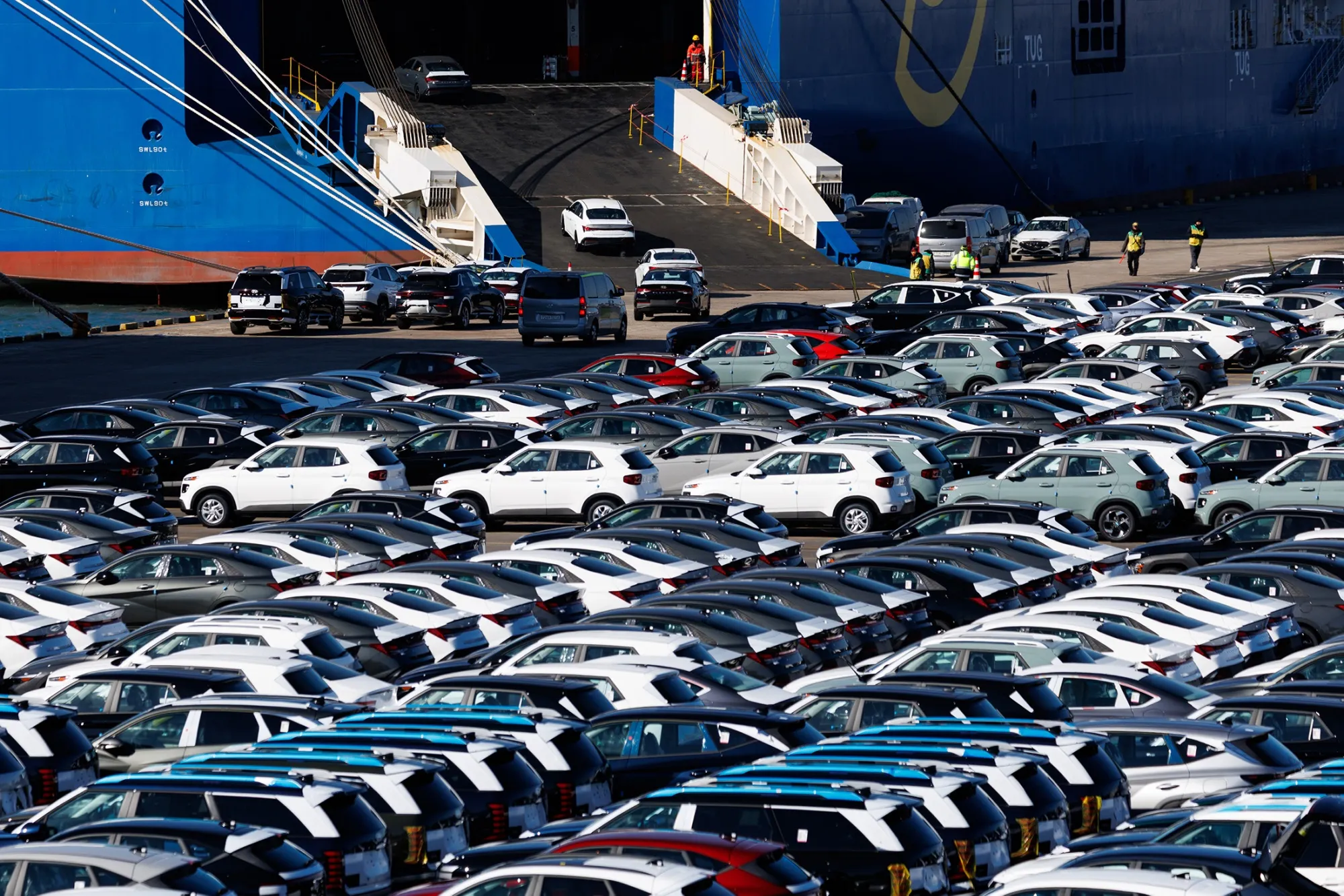 Hyundai Motor Co. vehicles drive into a vehicle carrier cargo ship&nbsp;in Ulsan, South Korea.