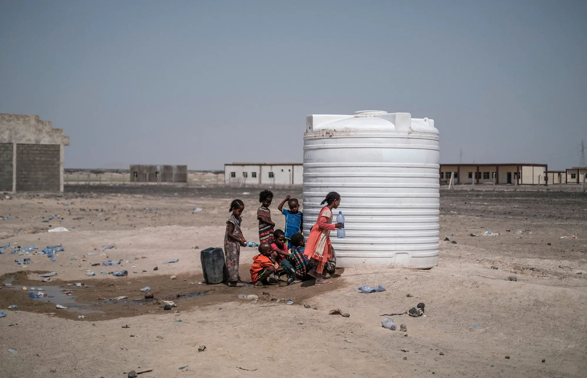 Internally displaced children collect water from a tank&nbsp;in the village of Afdera, Ethiopia, on Feb.&nbsp;15.