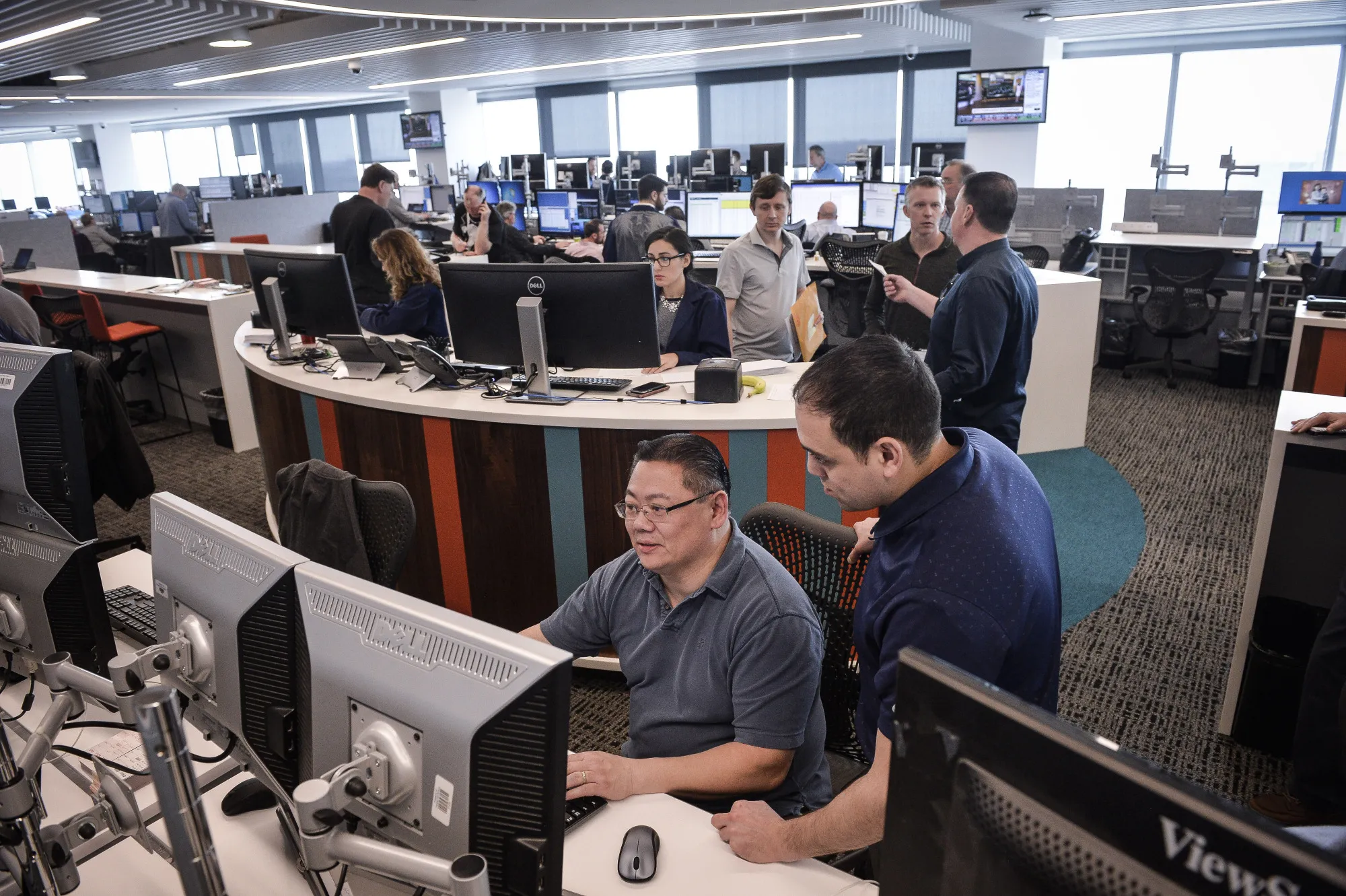 Traders work at Nasdaq's new options trading floor in Philadelphia.
