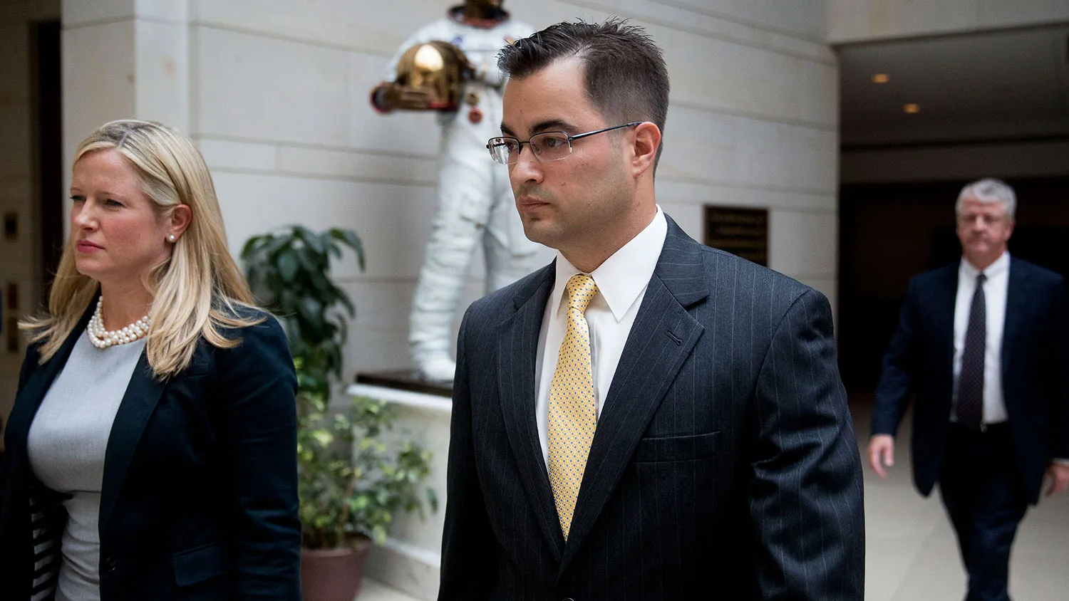 Bryan Pagliano, a former U.S. State Department employee, center, walks through the U.S. Capitol Visitor Center after leaving a House Benghazi Committee closed interview on Capitol Hill in Washington on Sept. 10, 2015.
