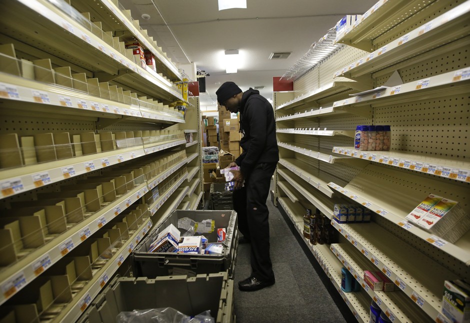 A worker stocks shelves at a temporary CVS store in the Rockaway Beach neighborhood of Queens, New York. CVS has set up a temporary store in the parking lot of a CVS location that had been damaged in Hurricane Sandy.