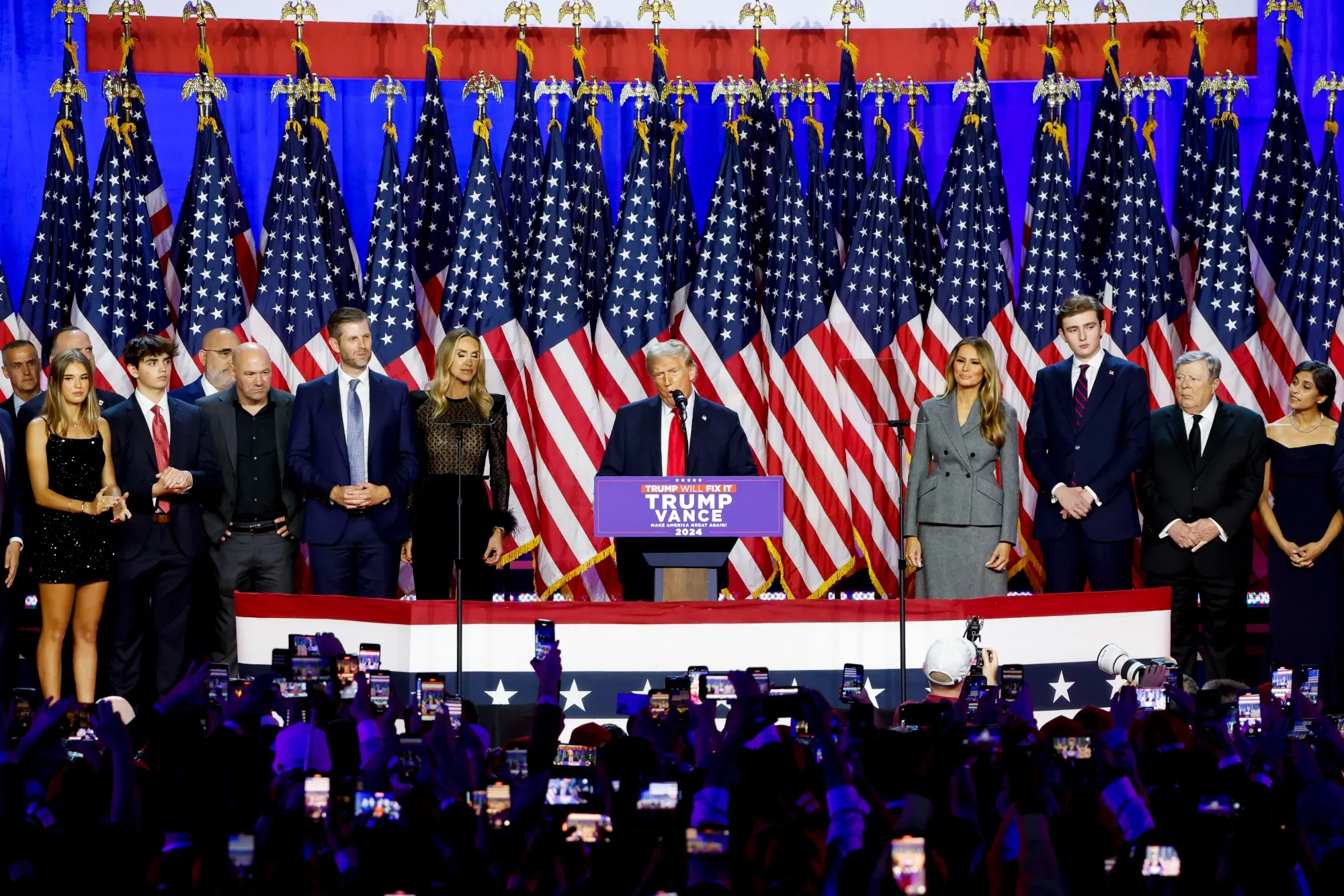 US President-elect Donald Trump, center, during his election night event at the Palm Beach Convention Center in West Palm Beach, Florida, US, on Wednesday, Nov. 6, 2024.