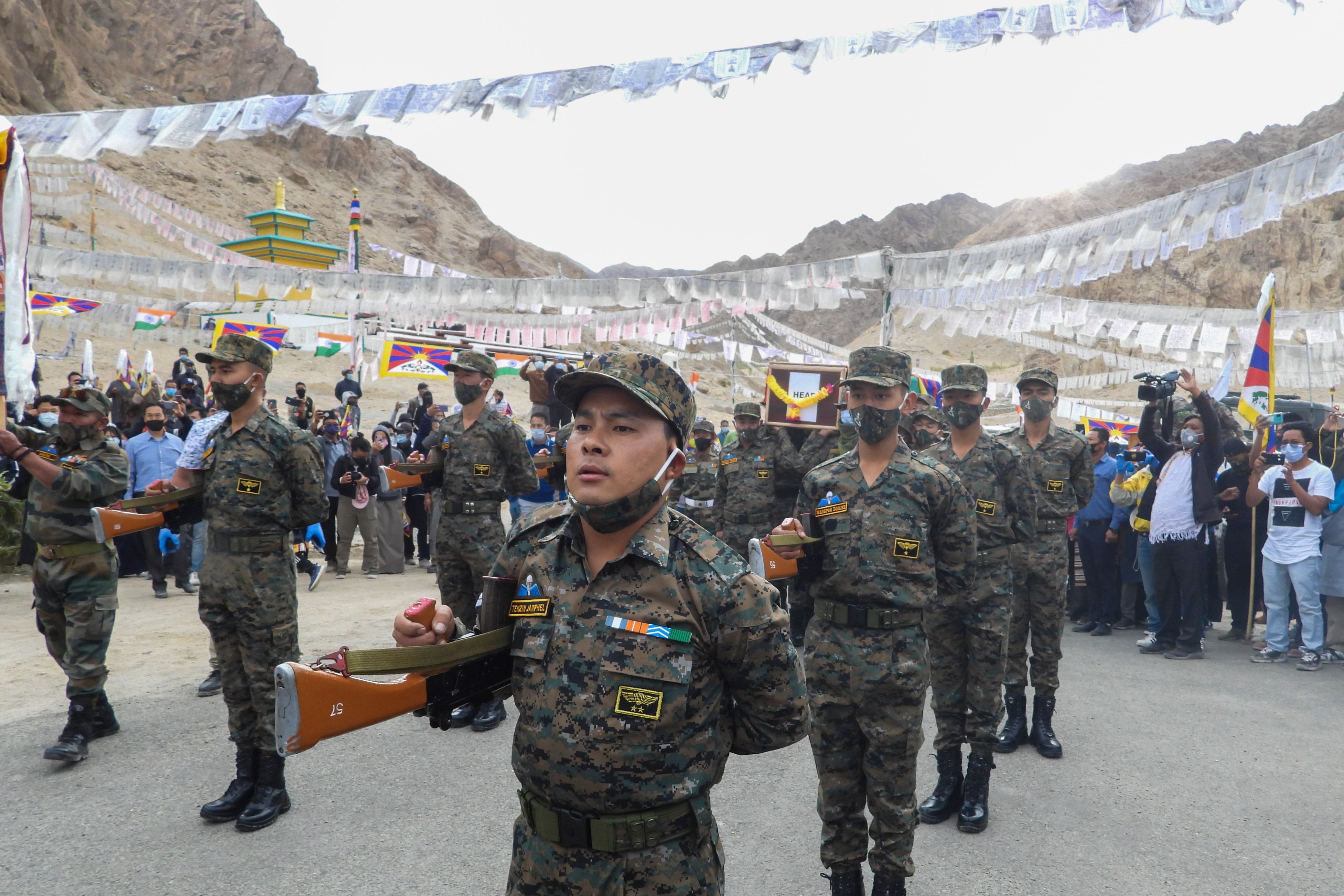 Indian troops pay respects to their fallen comrade, Tibetan-origin special forces soldier Nyima Tenzin in Leh on Sept. 7.
