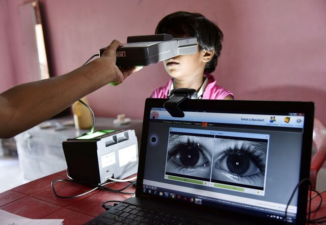 People undergo a verification process to link their Aadhaar card with National Register of Citizens (NRC) during a hearing at a Seva Kendra in Barpeta, Assam, India on August 10, 2019.