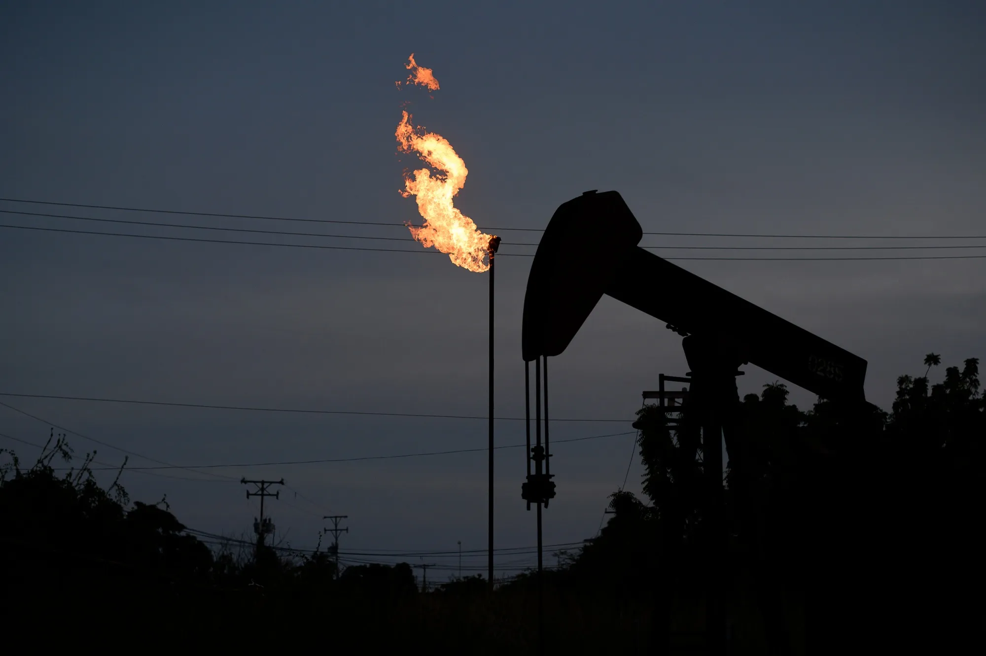 A Petroleos de Venezuela SA&nbsp;oil pump jack on Lake Maracaibo in Cabimas, Zulia state, Venezuela.