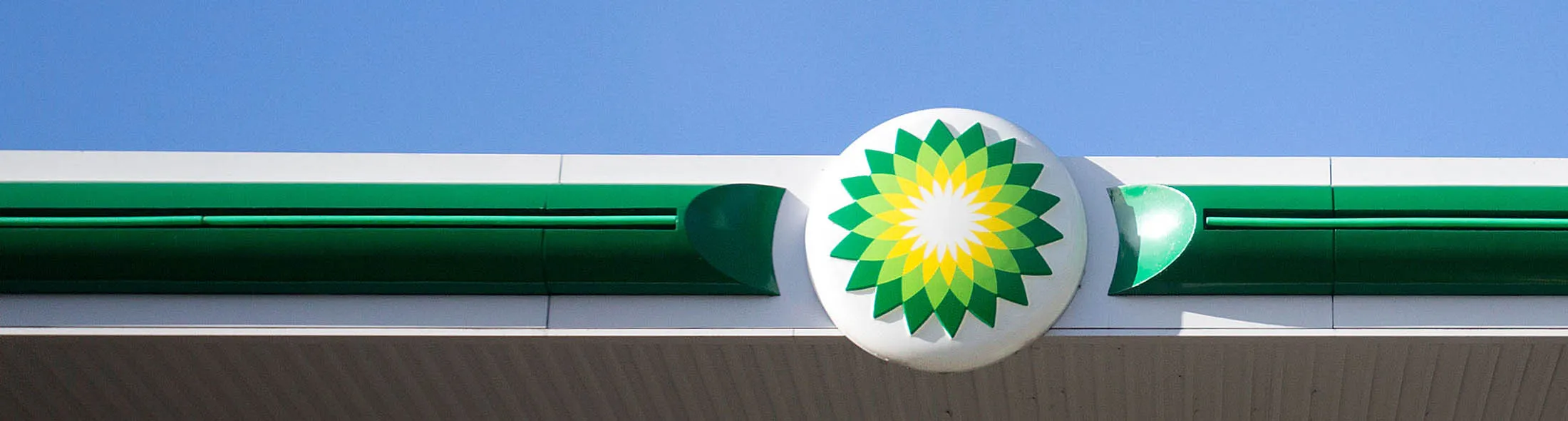 A BP Plc logo sits on a fore-court canopy at gas station operated by BP Plc in London, U.K., on Tuesday, Feb 2., 2016.
