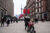 Pedestrians walk along Nanjing Road in Shanghai.