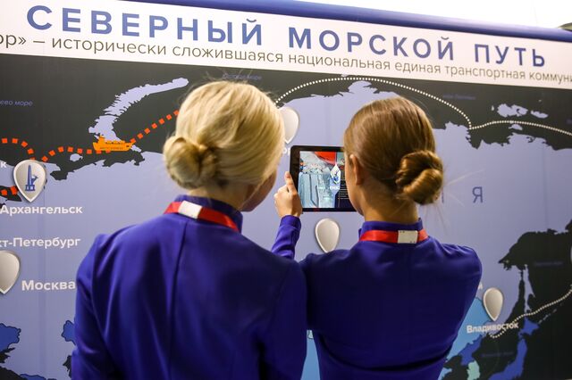 Attendees at the 5th International Arctic Forum in St. Petersburg, Russia use a tablet computer at a interactive map display of the Northern Sea Route on April 9, 2019.