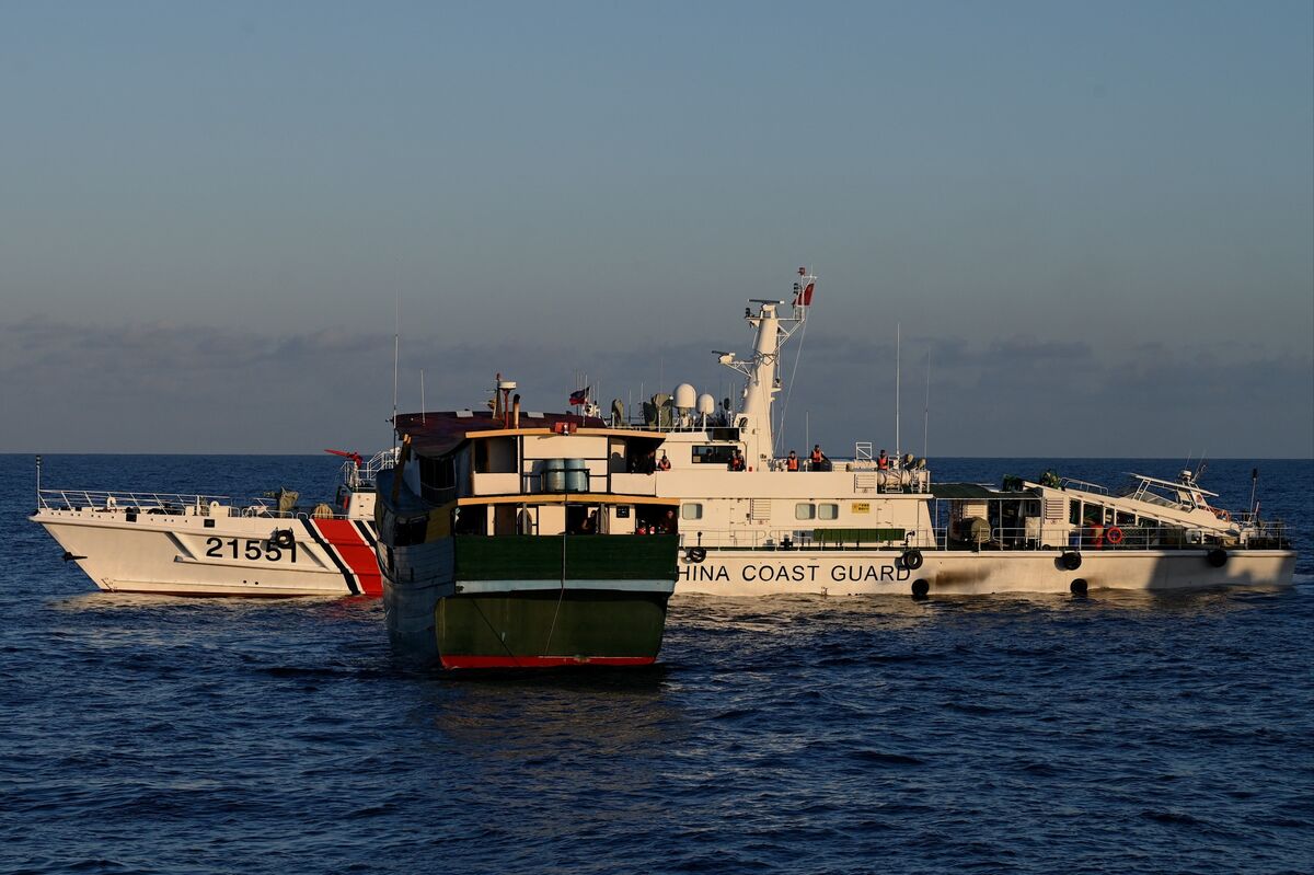 China’s Navy Ship Tails Philippine Coast Guard Amid Sea Spat - Bloomberg