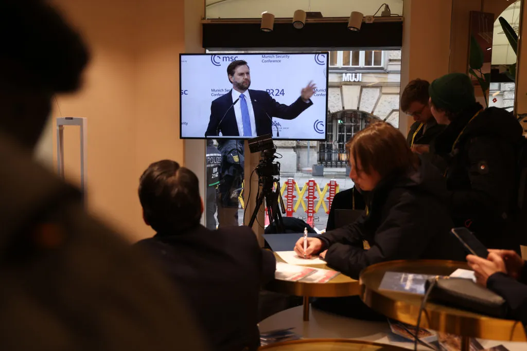 Members of the media watch U.S. Vice President J.D. Vance speak at the 61st Munich Security Conference on Feb. 14.