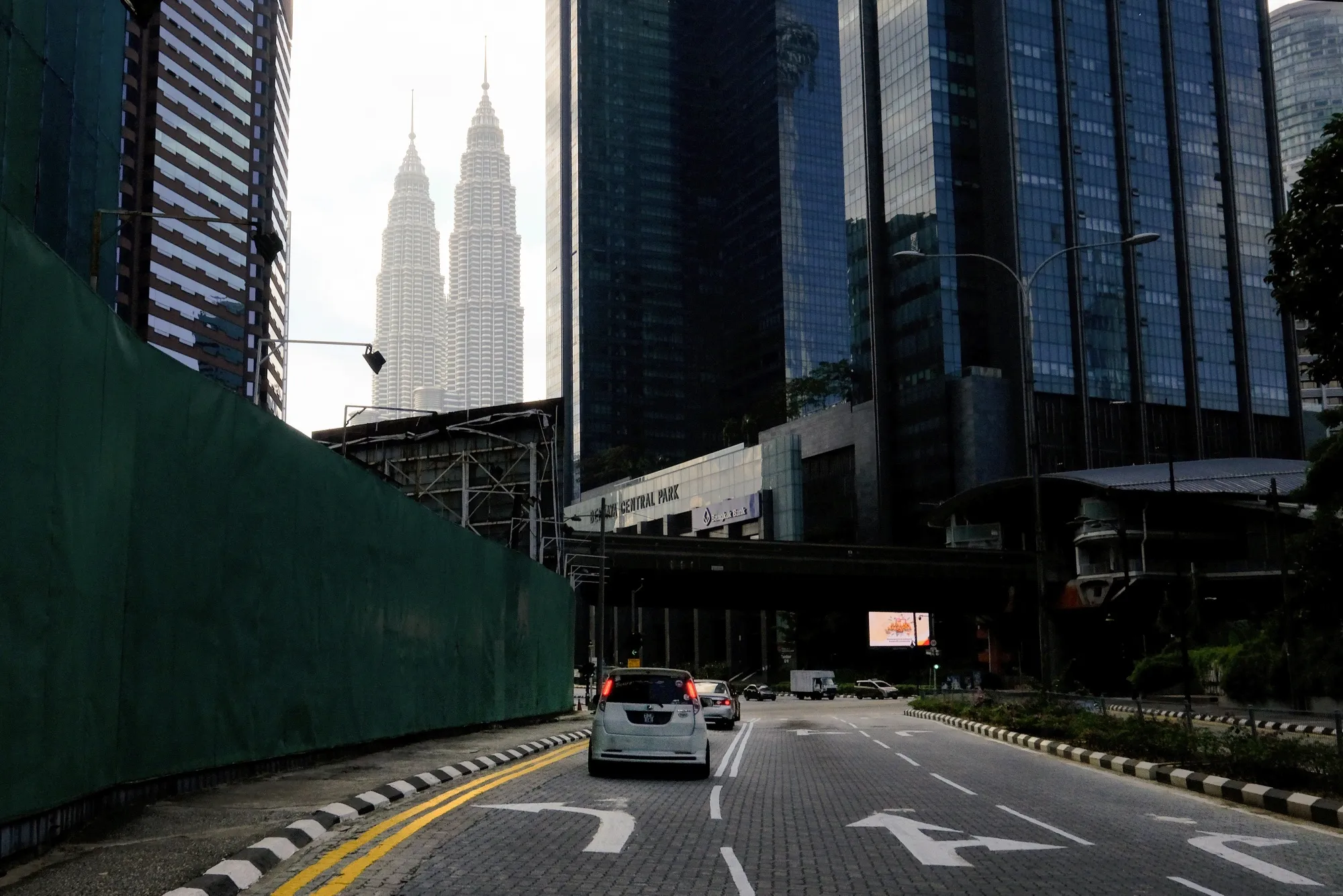 Vehicles travel along a near-empty road in Kuala Lumpur, June 1.