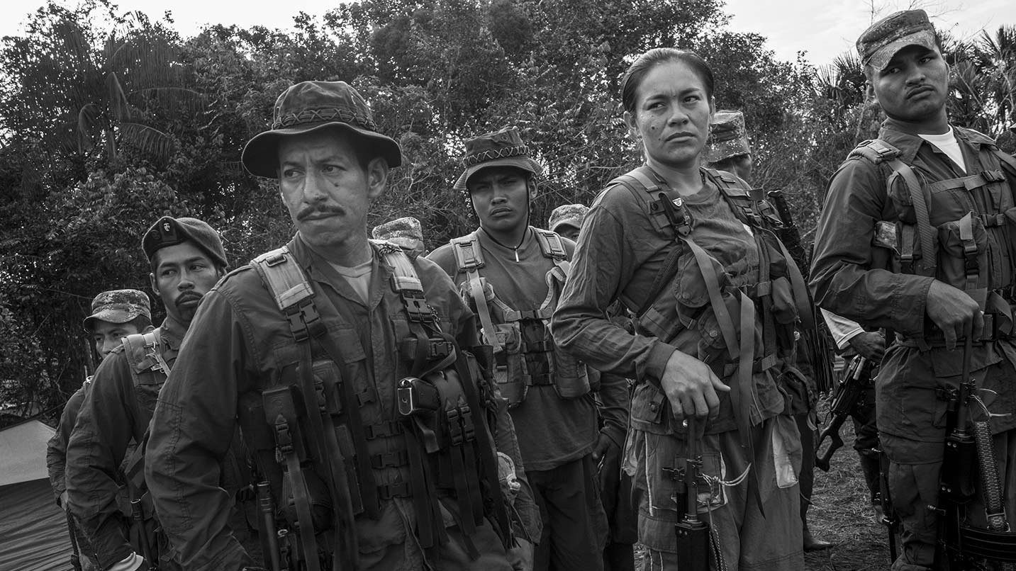 (EDITORS NOTE: Image has been converted to black and white.) Revolutionary Armed Forces of Columbia (FARC) rebels receive instructions for the day during FARC's 10th National Guerrilla conference in the Yari plains of El Diamante, Columbia, on Sunday, Sept. 18, 2016. Colombia's President Juan Manuel Santos signed a peace accord with Marxist guerrillas, setting in motion the disarmament of the largest irregular army in the Americas and officially ending more than half a century of conflict. FARC will hand over their weapons to the United Nations under the deal, in return for seats in Congress, agricultural reform and reduced punishment for crimes.
