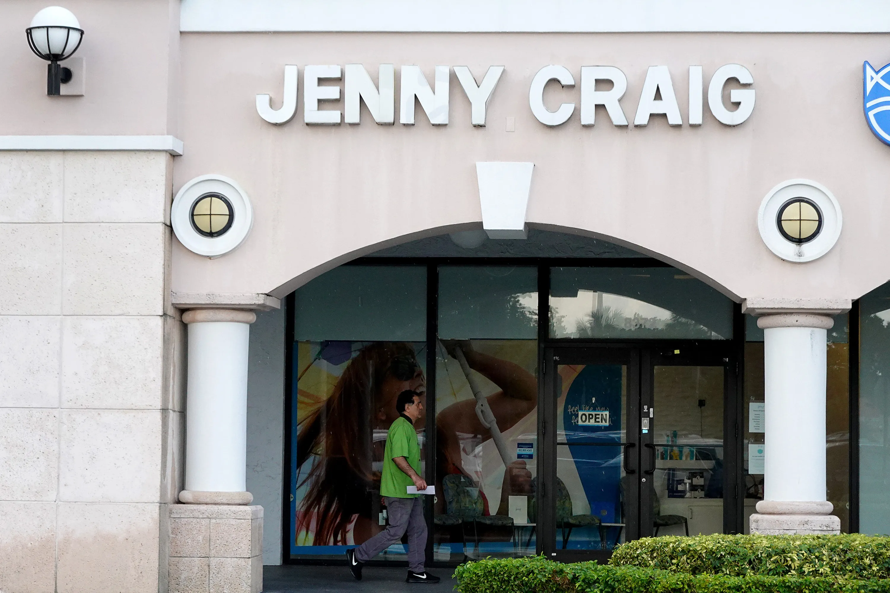 A person walks past a Jenny Craig weight loss store&nbsp;in Miami, Florida.&nbsp;