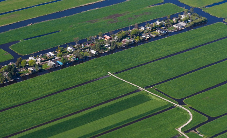 Houses on polders (pieces of reclaimed land) near Amsterdam.