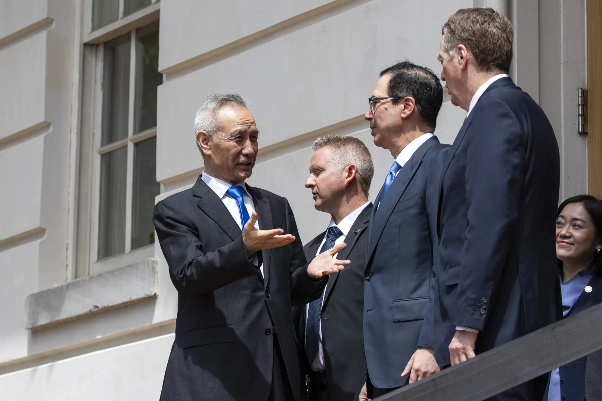 Liu He, left, speaks with Robert Lighthize and Steven Mnuchin in Washington on May 10.
