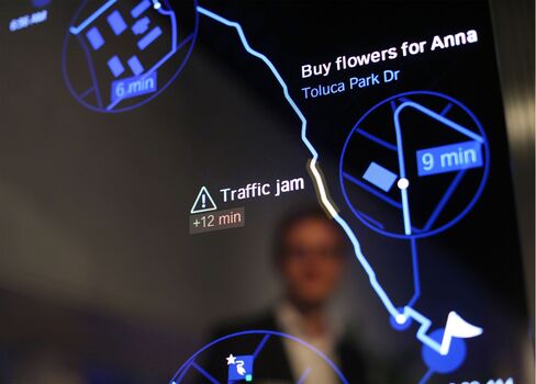A BMW Connected Mirror shows route warnings and reminders