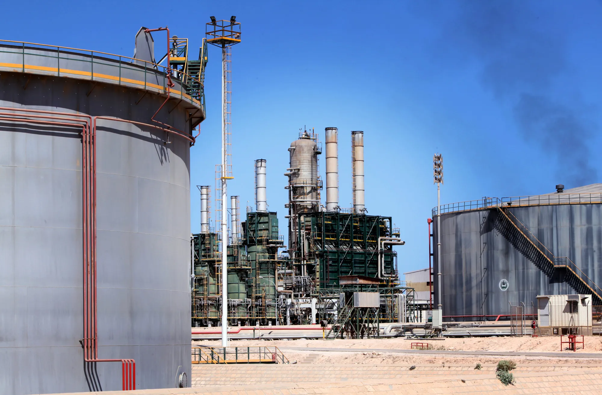 Refining towers and fuel storage tanks&nbsp;at the Zawiya oil refinery near Tripoli, Libya.