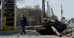 The turret of a Russian tank sits next to a destroyed petrol station in the village of Skybyn, northeast of Kyiv on May 2.&nbsp;