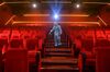 A worker sanitizes a cinema in Mumbai on Oct. 13.