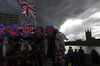 A stall selling tourist souvenirs sits on the banks of the River Thames in view of the Houses of Parliament in London, U.K., on Tuesday, Oct. 15, 2019. U.K. Prime Minister Boris Johnson's hopes of a Brexit deal are likely to depend on him not only persuading the European Union to compromise, but his Northern Irish allies too.