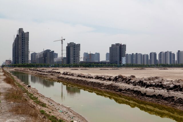 Construction projects in the Bohai New Area port zone of Cangzhou, China in 2011. In China, as in the U.S. before the collapse of the subprime mortgage market in 2008, local borrowing has been backed by collateral that is overvalued, may be hard to sell and, in at least one case, doesn't exist yet. 