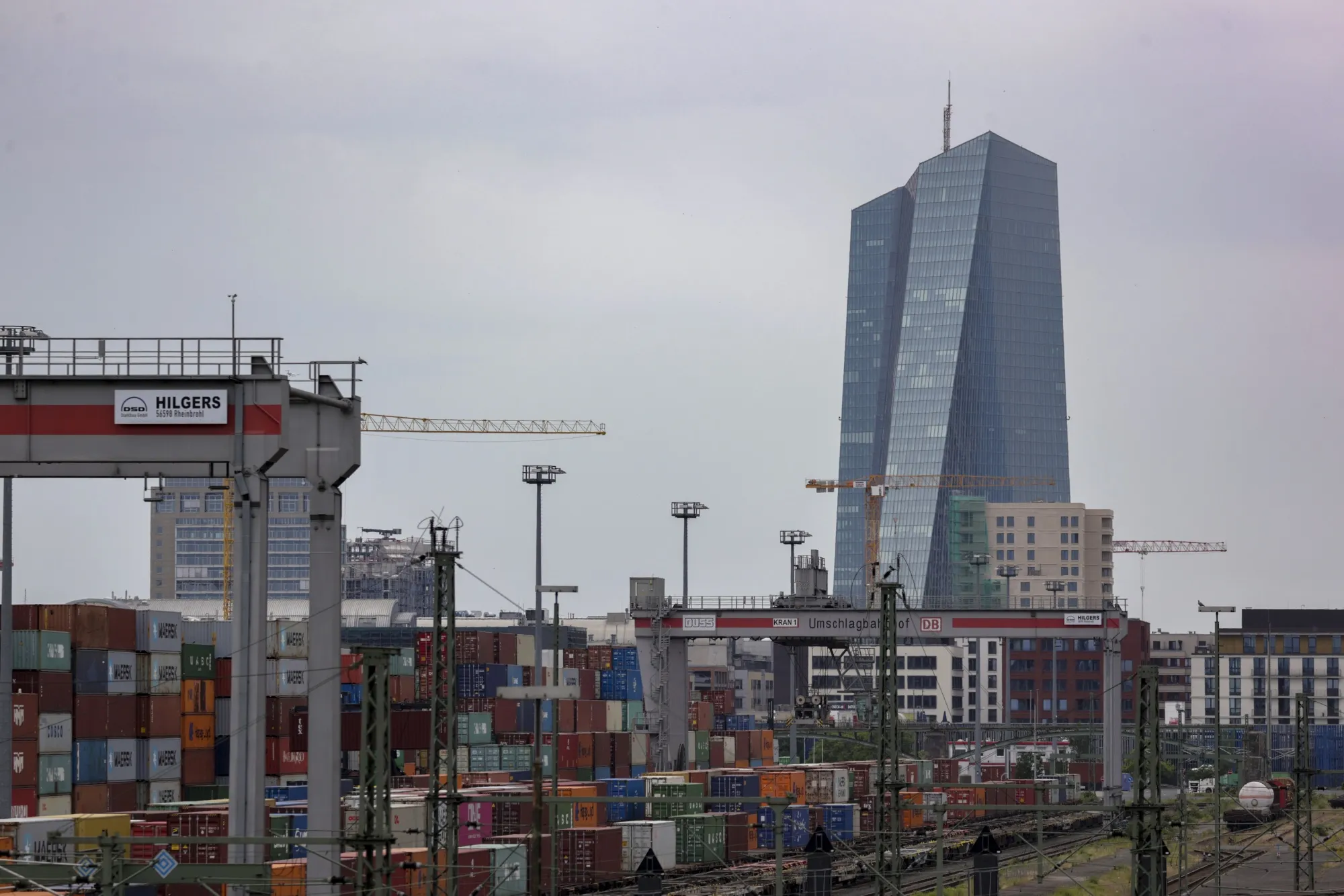 The European Central Bank headquarters beyond cargo trains and containers at a freight terminal in Frankfurt, Germany.